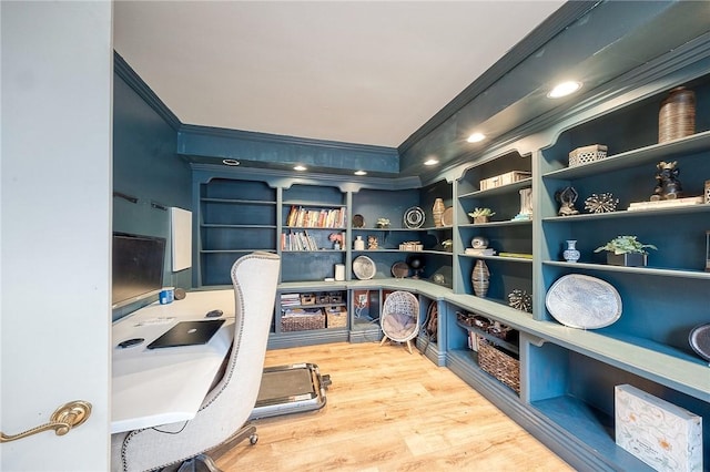 office area with crown molding and wood finished floors