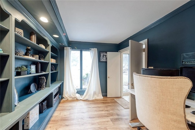 office space featuring crown molding and light wood-style flooring