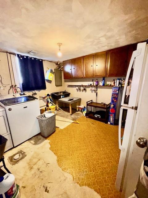 kitchen with fridge and brown cabinets