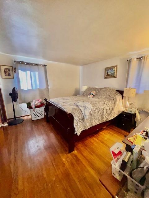 bedroom featuring wood finished floors