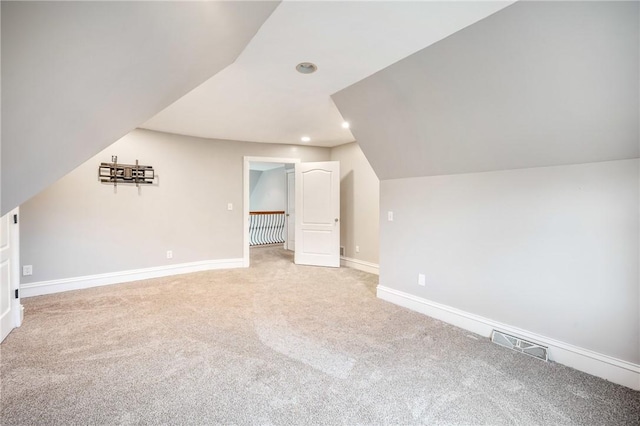 bonus room with recessed lighting, visible vents, light carpet, vaulted ceiling, and baseboards