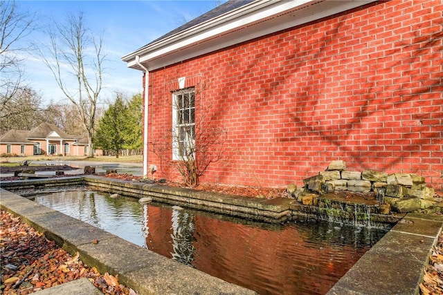 view of property exterior featuring brick siding