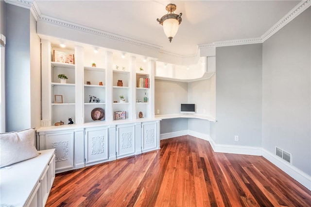 interior space with dark wood-style floors, baseboards, and visible vents