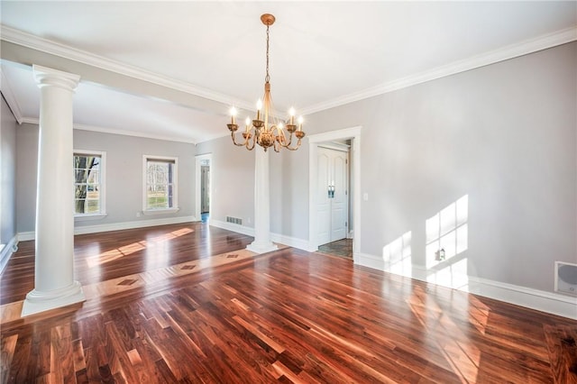 unfurnished dining area with visible vents, decorative columns, baseboards, and wood finished floors