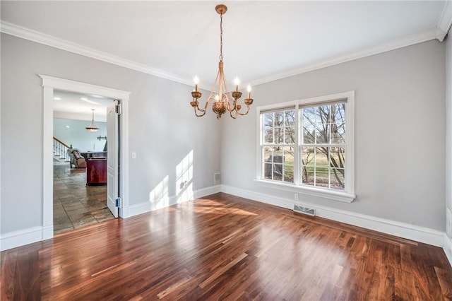 unfurnished dining area featuring baseboards, visible vents, stairway, ornamental molding, and wood finished floors