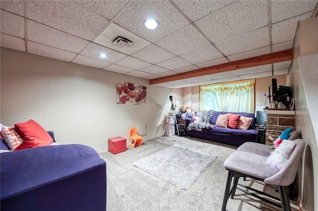 carpeted living area featuring a paneled ceiling, visible vents, and recessed lighting