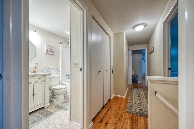 hallway featuring light wood-style floors