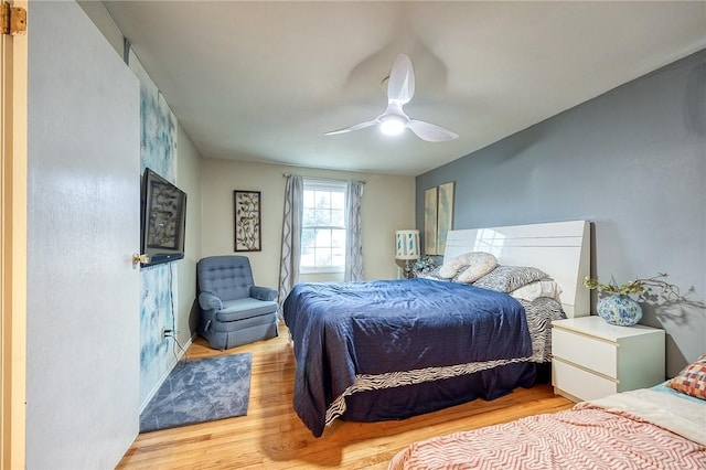 bedroom featuring a ceiling fan and wood finished floors