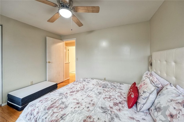 bedroom featuring ceiling fan and wood finished floors