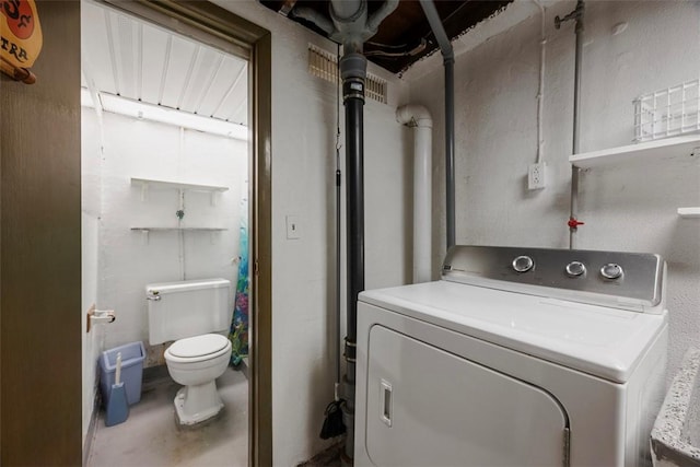 clothes washing area with laundry area and washer / clothes dryer