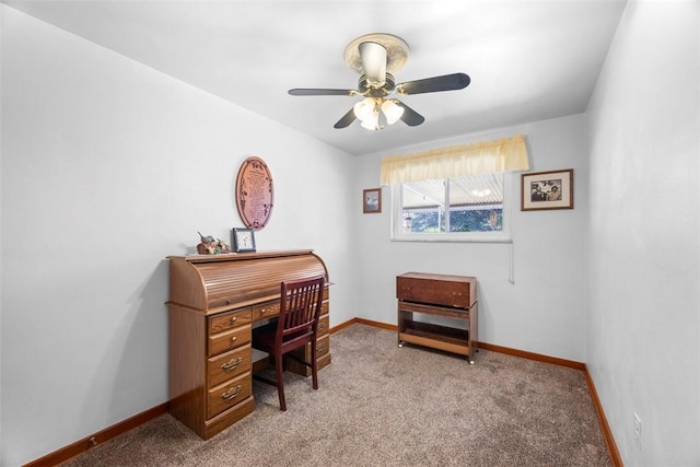 office space with light carpet, ceiling fan, and baseboards