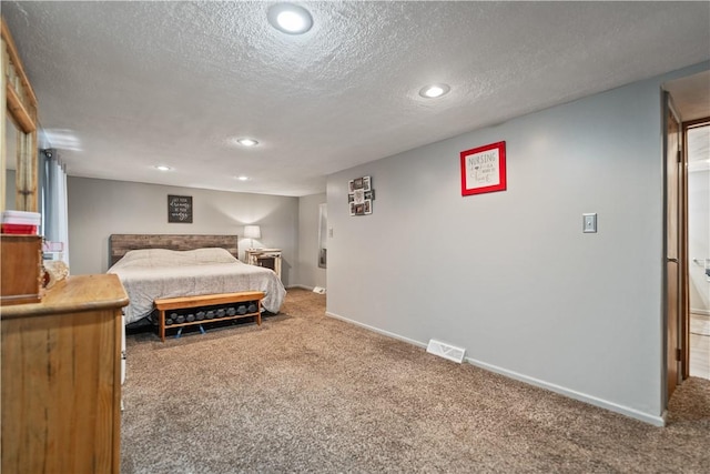 carpeted bedroom featuring recessed lighting, visible vents, a textured ceiling, and baseboards