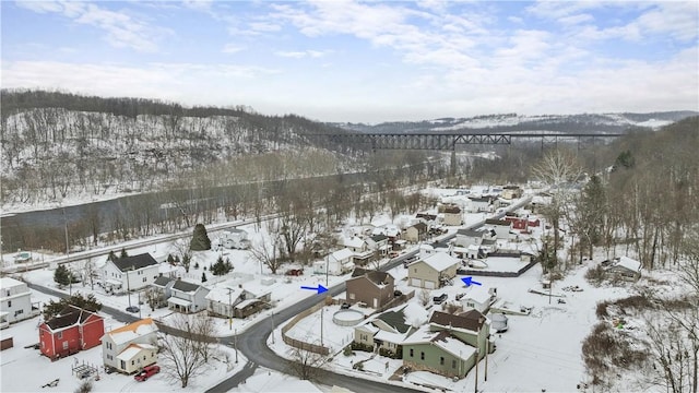 snowy aerial view featuring a residential view