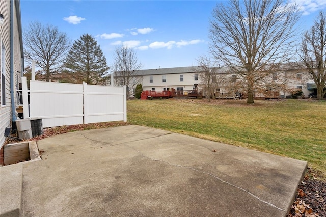 view of yard with fence and a patio