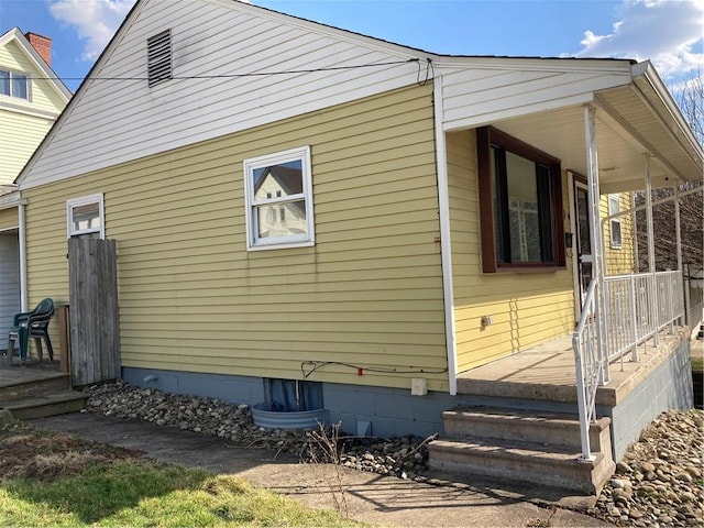 view of home's exterior with covered porch