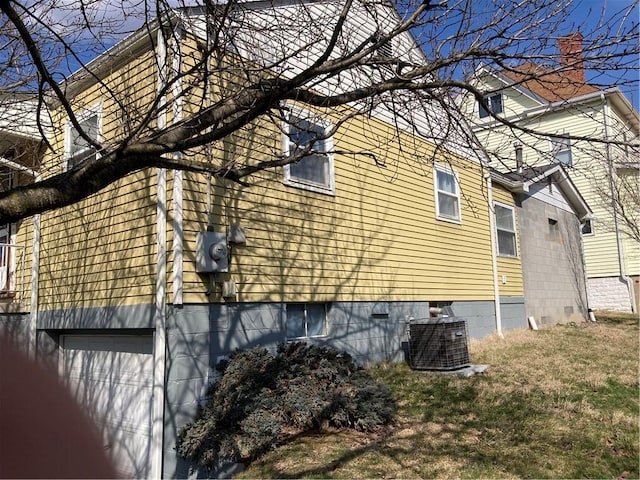 view of home's exterior with crawl space and central air condition unit