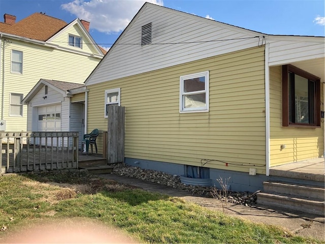 rear view of house featuring a deck