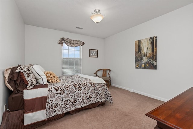 bedroom featuring carpet floors, baseboards, and visible vents