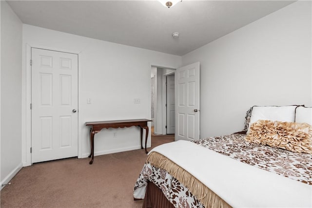 carpeted bedroom with baseboards