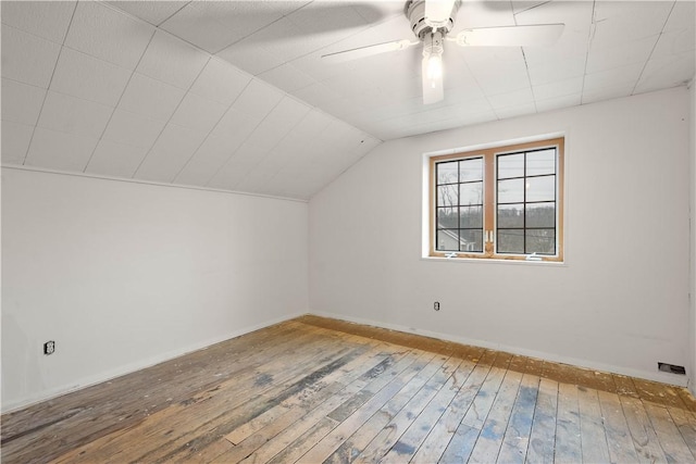 bonus room featuring lofted ceiling, ceiling fan, hardwood / wood-style floors, and baseboards