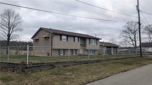 view of front of home featuring brick siding, a fenced front yard, and a front yard