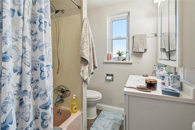 full bathroom featuring shower / bath combo, baseboards, vanity, and toilet