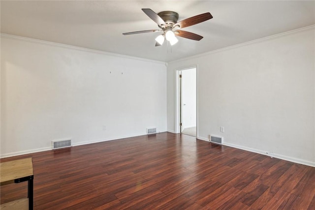 empty room featuring visible vents and wood finished floors