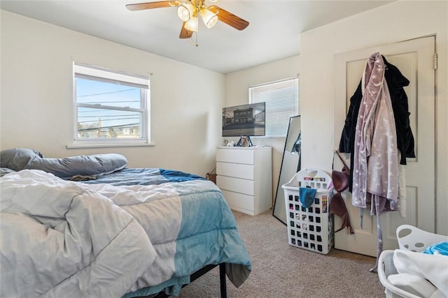 bedroom with carpet and a ceiling fan