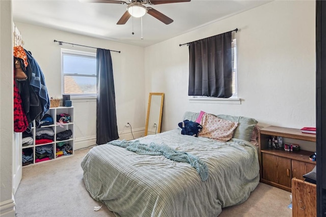 bedroom with carpet floors and a ceiling fan