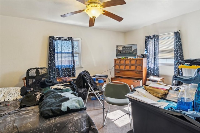 bedroom with ceiling fan and carpet