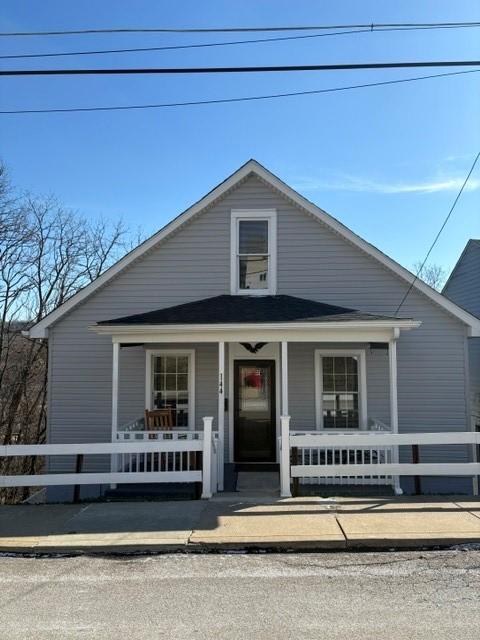 bungalow with fence and a porch