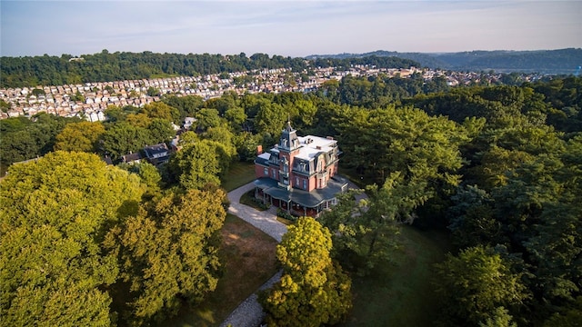 drone / aerial view featuring a forest view