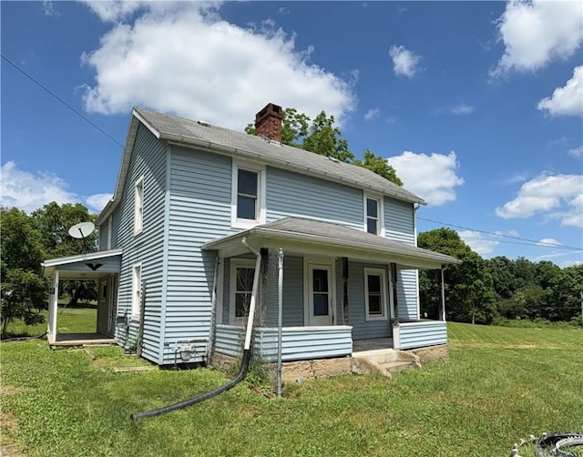 2343 Downing Ln, Hermitage, PA 16148 - view of front of house featuring a porch, a chimney, and a front lawn