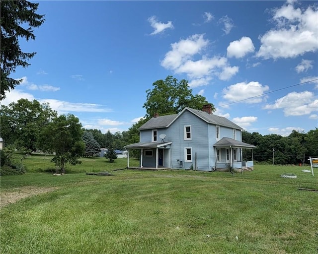 2343 Downing Ln, Hermitage, PA 16148 - back of house featuring a lawn and a chimney