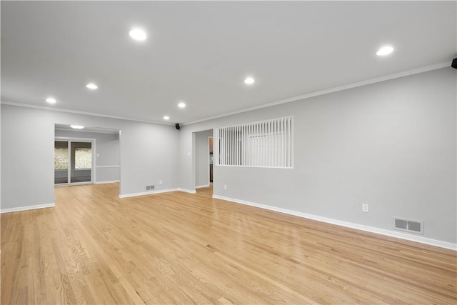 unfurnished room with light wood finished floors, baseboards, ornamental molding, and recessed lighting