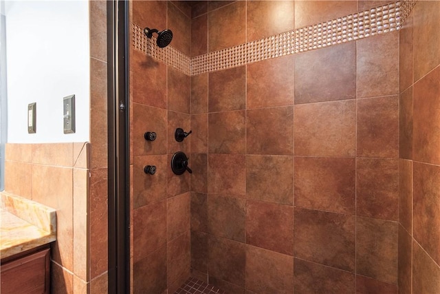 full bath featuring a stall shower and vanity