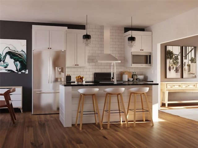 kitchen featuring dark wood-style floors, backsplash, appliances with stainless steel finishes, white cabinetry, and wall chimney exhaust hood