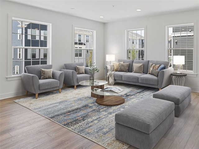 living room with recessed lighting, wood finished floors, and baseboards