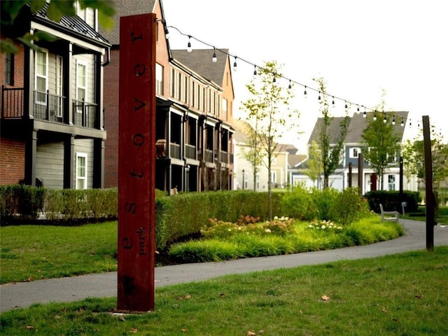 view of community featuring a lawn and a residential view