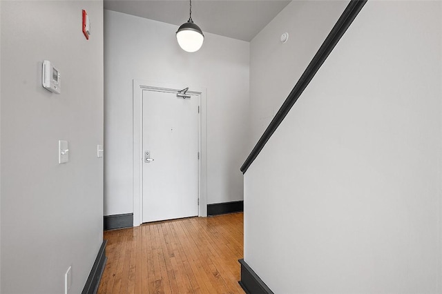 entrance foyer with light wood-style flooring and baseboards