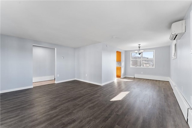 unfurnished room featuring a chandelier, a wall unit AC, dark wood finished floors, and baseboards