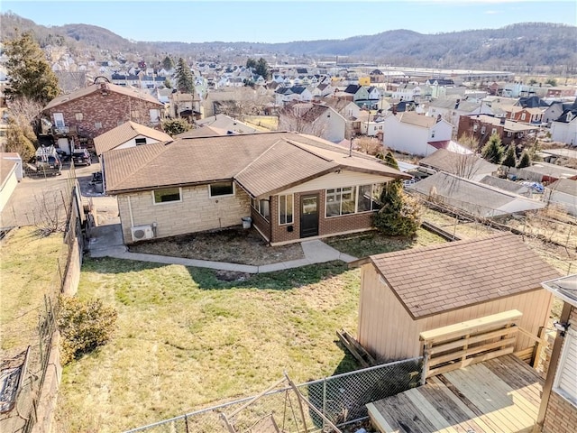 drone / aerial view with a residential view and a mountain view