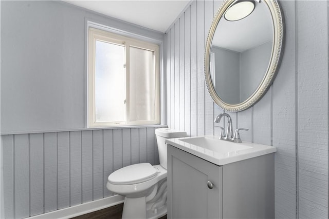 bathroom featuring vanity and toilet