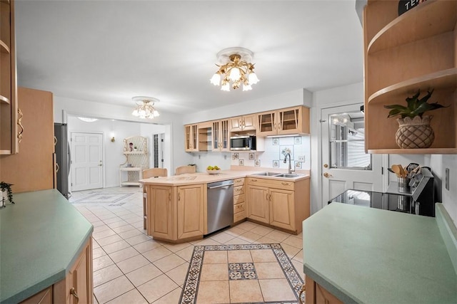 kitchen with light tile patterned floors, a sink, stainless steel appliances, open shelves, and a notable chandelier