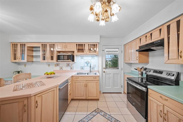 kitchen featuring light tile patterned floors, stainless steel appliances, under cabinet range hood, light brown cabinets, and a sink