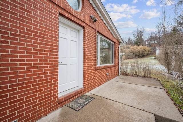 entrance to property with brick siding