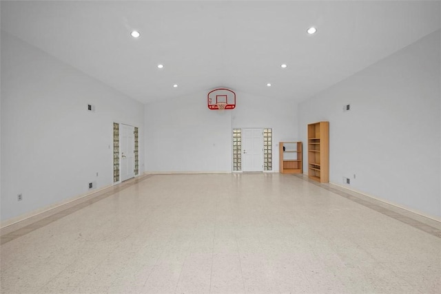 unfurnished living room with high vaulted ceiling, recessed lighting, and tile patterned floors