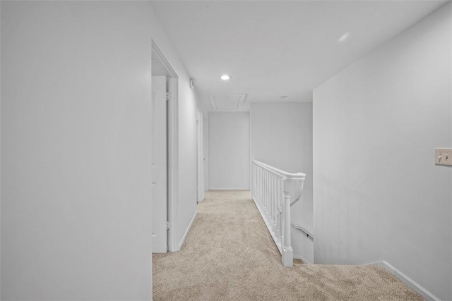 hall featuring carpet, recessed lighting, attic access, an upstairs landing, and baseboards