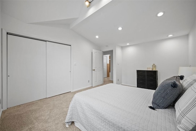 bedroom featuring vaulted ceiling, a closet, carpet flooring, and recessed lighting