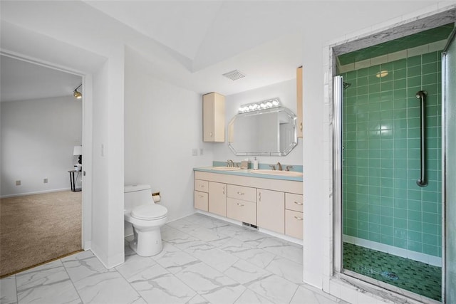 bathroom with marble finish floor, visible vents, toilet, a stall shower, and a sink